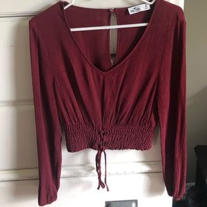 a cute crop top with a unique string bottom